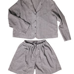 portrait image, merchant and mills Winnie pyjama pattern, flat lay pyjamas, longsleeve shirt, elasticated waist shorts, white background, fabric is brown and light mauve stripe.