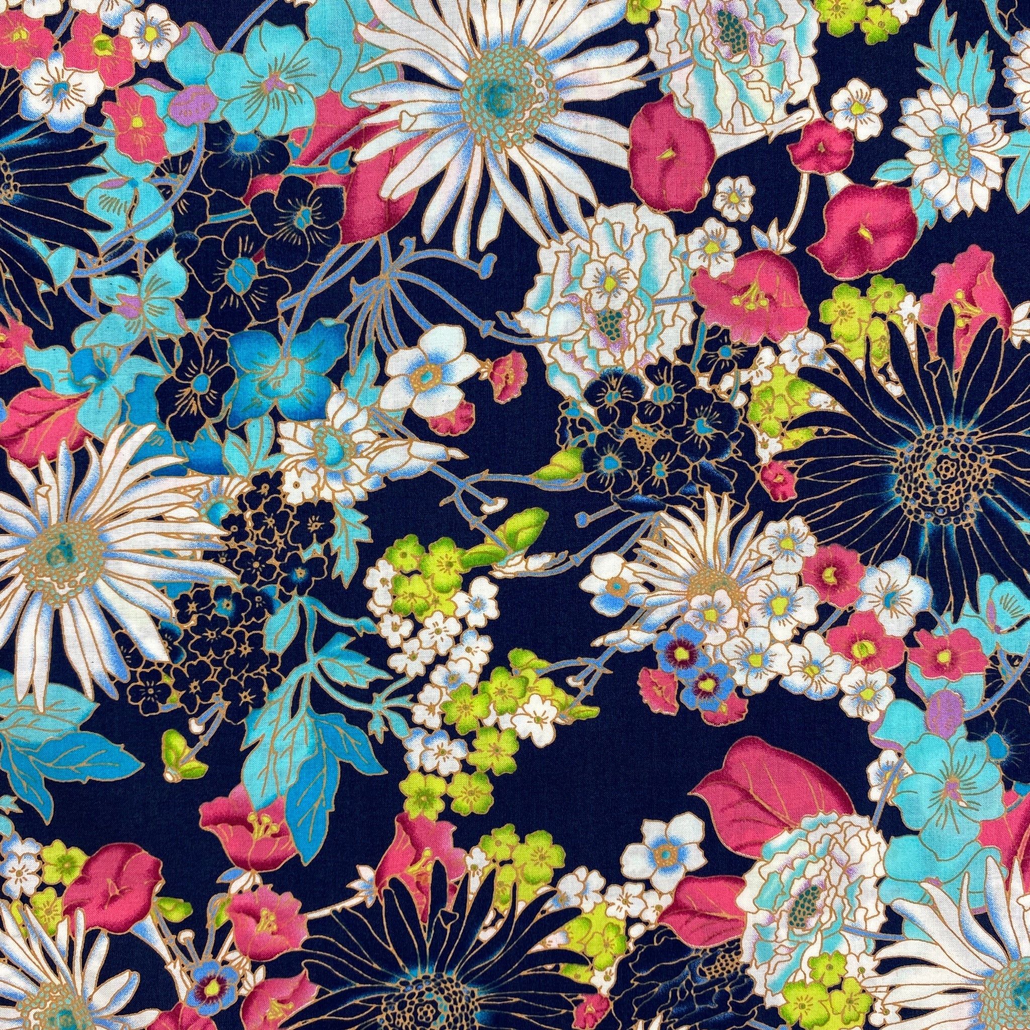 dressmaking fabric, cotton lawn, dark blue background, variety of flowers in barbie pink, apple green, sea blue, white, flowers outlined in a none shine gold. image is displayed flat.